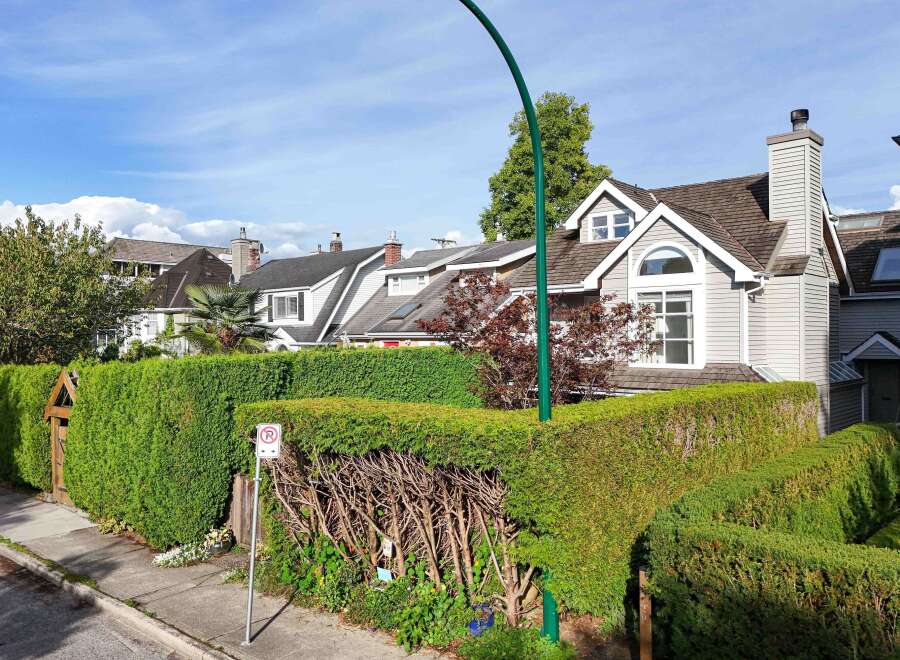 This charming house boasts a unique architectural design, featuring a blend of traditional and modern elements.