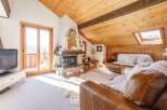 Discover the charm of this cozy living space, featuring a stunning fireplace and a warm, inviting atmosphere.