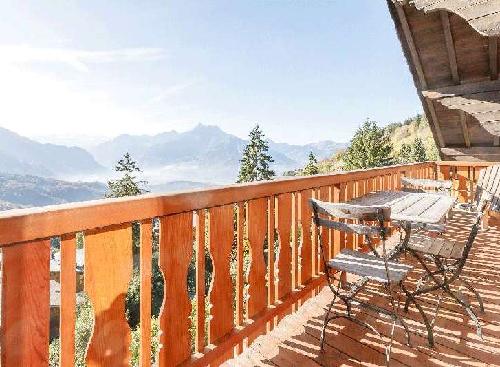 Enjoy breathtaking mountain views from this charming balcony.