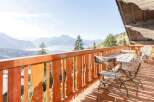 Enjoy breathtaking mountain views from this charming balcony.