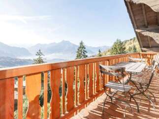Enjoy breathtaking mountain views from this charming balcony.