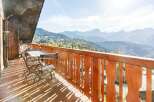 Enjoy breathtaking mountain views from this charming balcony.
