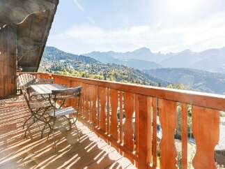 Enjoy breathtaking mountain views from this charming balcony.
