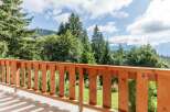 Enjoy breathtaking mountain views from this charming balcony.