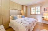 Cozy bedroom with a comfortable bed and stylish decor.