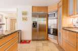 This stunning kitchen boasts modern appliances and custom cabinetry.