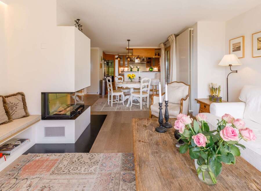 This stunning property boasts a modern fireplace, creating a cozy ambiance.