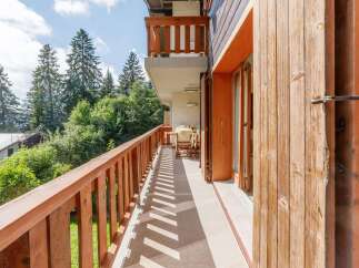 Enjoy the tranquility of this charming balcony, perfect for relaxing and soaking in the natural beauty.