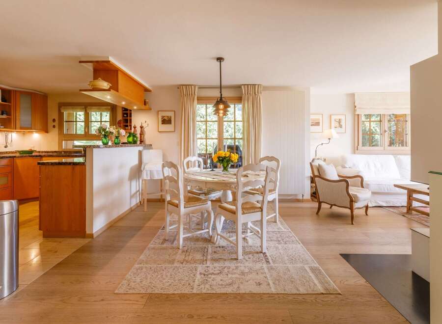 Step into a charming, light-filled home with a seamless blend of kitchen and living spaces.