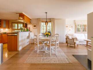Step into a charming, light-filled home with a seamless blend of kitchen and living spaces.