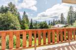 Enjoy breathtaking mountain views from this charming balcony.