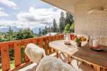 Enjoy breathtaking mountain views from this charming balcony.
