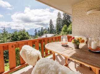 Enjoy breathtaking mountain views from this charming balcony.