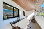 Enjoy outdoor dining with mountain views on this spacious balcony.