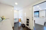 This stunning property boasts a bright and airy laundry room, complete with modern appliances and ample storage.