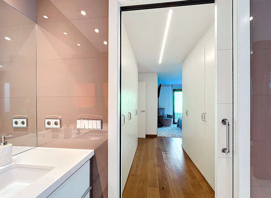 This stunning property boasts a modern bathroom with sleek, high-end finishes and fixtures.