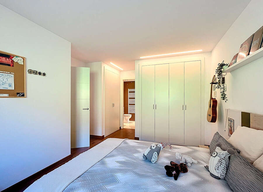 Bright and airy bedroom with built-in wardrobes and ensuite bathroom.