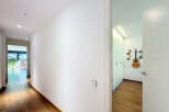 This stunning property boasts a bright and spacious hallway with gleaming hardwood floors.
