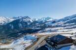 This stunning chalet boasts breathtaking panoramic views of the French Alps, offering a luxurious escape in a pristine winter wonderland.
