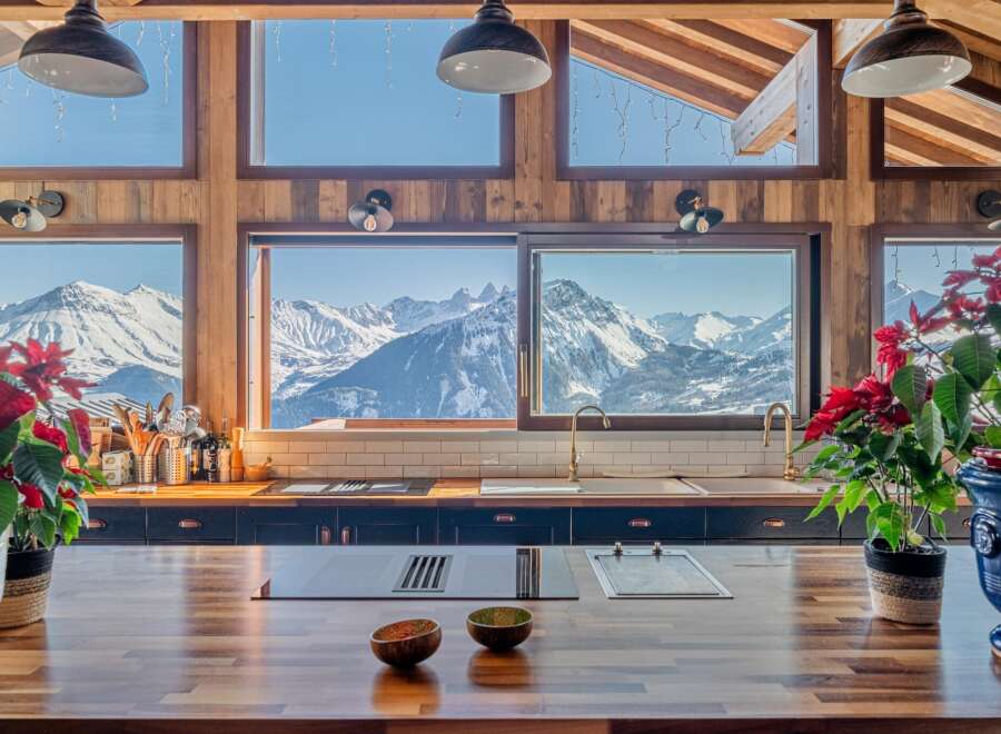 Luxury chalet kitchen with stunning mountain views.