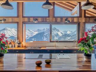 Luxury chalet kitchen with stunning mountain views.