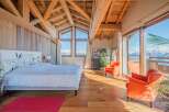 Luxurious chalet bedroom with stunning mountain views.
