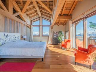 Luxurious chalet bedroom with stunning mountain views.