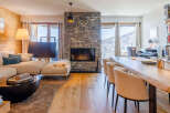 Experience luxury living in this stunning property, featuring a cozy fireplace and a spacious living area.
