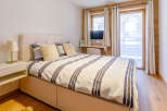 This cozy bedroom features a comfortable bed with stylish bedding and plush pillows.