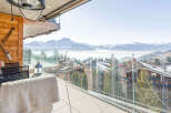 Enjoy breathtaking mountain views from this luxurious balcony.