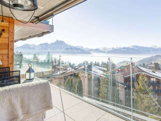Enjoy breathtaking mountain views from this luxurious balcony.