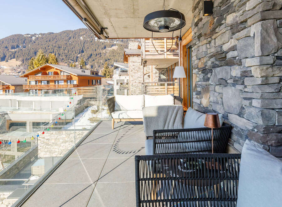 Enjoy breathtaking mountain views from this luxurious balcony.