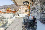 Enjoy breathtaking mountain views from this luxurious balcony.