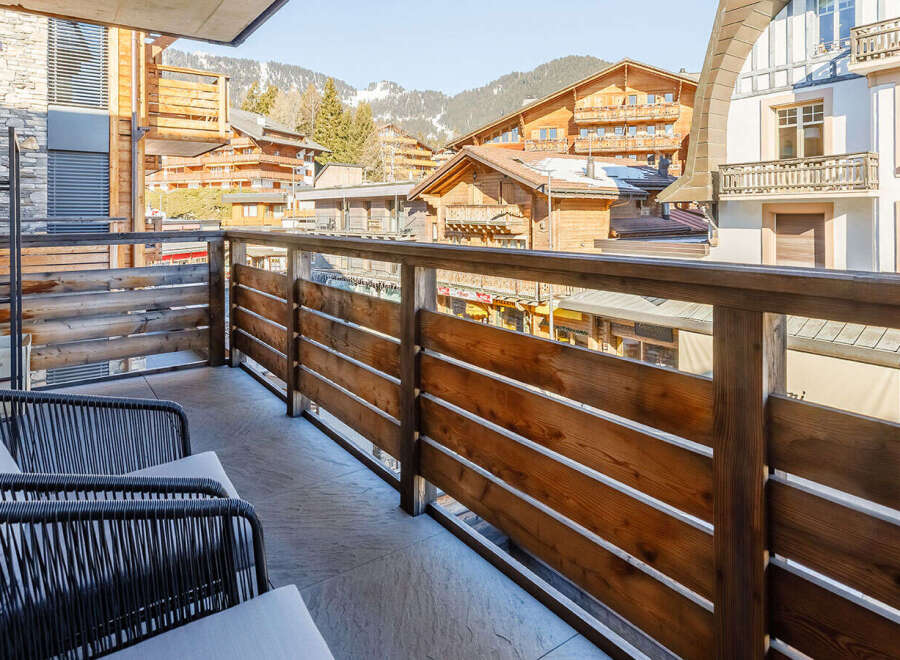 Enjoy breathtaking mountain views from this charming balcony.