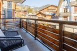 Enjoy breathtaking mountain views from this charming balcony.