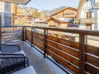 Enjoy breathtaking mountain views from this charming balcony.