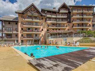 This stunning resort boasts a sparkling outdoor pool, perfect for a refreshing dip after a day of adventure.