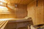 Relax and rejuvenate in this exquisite sauna, featuring a calming wooden interior and ample seating.
