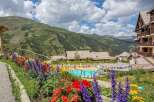 Nestled in the French Alps, this stunning resort boasts breathtaking mountain views and a sparkling outdoor pool.