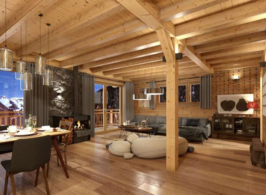 This stunning chalet boasts a spacious open-plan living area with exposed wooden beams, a cozy fireplace, and large windows offering breathtaking mountain views.