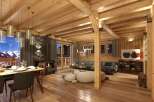 This stunning chalet boasts a spacious open-plan living area with exposed wooden beams, a cozy fireplace, and large windows offering breathtaking mountain views.