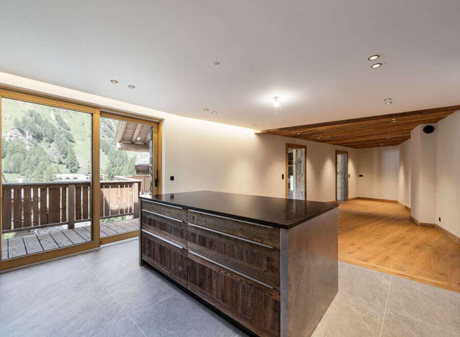 Experience modern living with a touch of rustic charm in this spacious open-plan apartment.