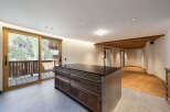 Experience modern living with a touch of rustic charm in this spacious open-plan apartment.