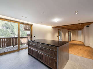 Experience modern living with a touch of rustic charm in this spacious open-plan apartment.