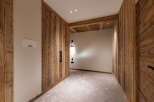 Experience rustic charm and modern comfort in this beautifully appointed room, featuring warm, natural wood paneling throughout.
