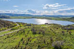 Luxury lakefront property with stunning mountain views and private access road.