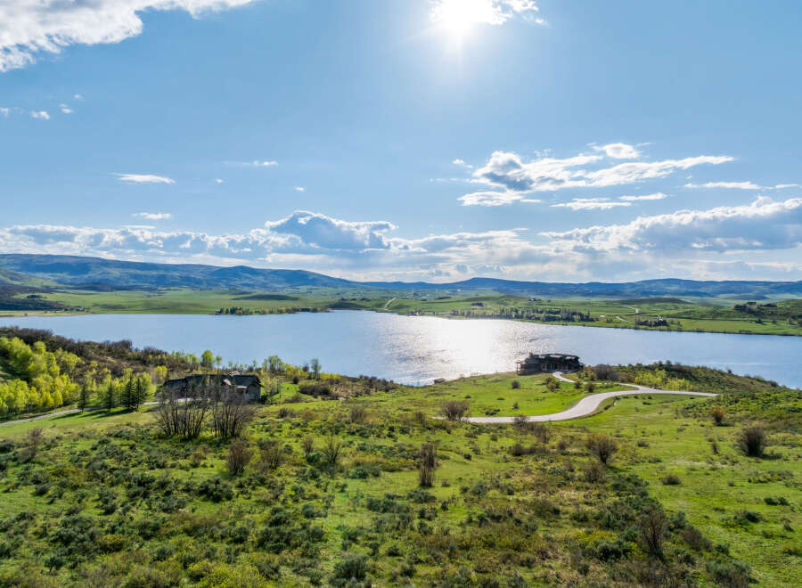 Luxury lakefront property with stunning mountain views.