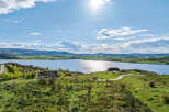 Luxury lakefront property with stunning mountain views.