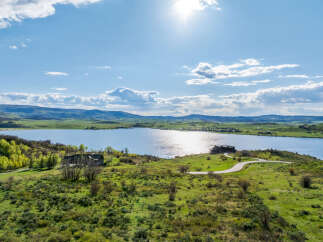 Luxury lakefront property with stunning mountain views.