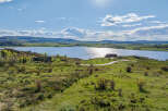 Luxury lakefront property with stunning mountain views.